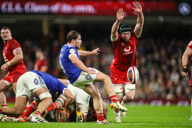 Antoine Dupont of France kicks the ball as Adam Beard of Wales attempts to charge down during the Guinness Six Nations match Wales vs France at Principality Stadium, Cardiff, United Kingdom, 15th February 2026

(Photo by Andrew Lewis/News Images)