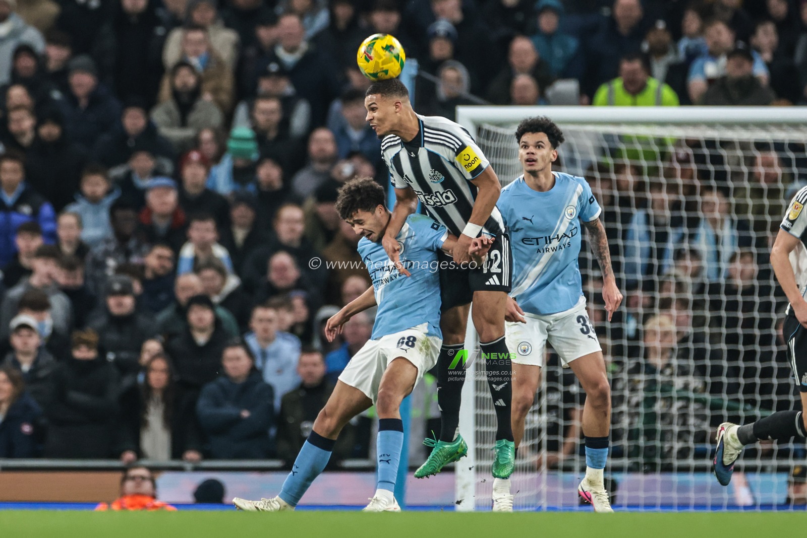 Malick Thiaw of Newcastle United jumps up to win the high ball during the Carabao Cup Semi-Final second leg match Manchester City vs Newcastle United at Etihad Stadium, Manchester, United Kingdom, 4th February 2026

(Photo by Mark Cosgrove/News Images)