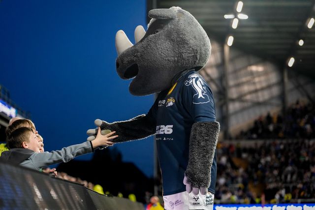 Ronnie the Rhino celebrates a try with young fans during the Betfred Super League round 9 match Leeds Rhinos vs Catalans Dragons at AMT Headingley Stadium, Leeds, United Kingdom on 24 April 2026

(Photo by Maynard Manyowa/News Images)