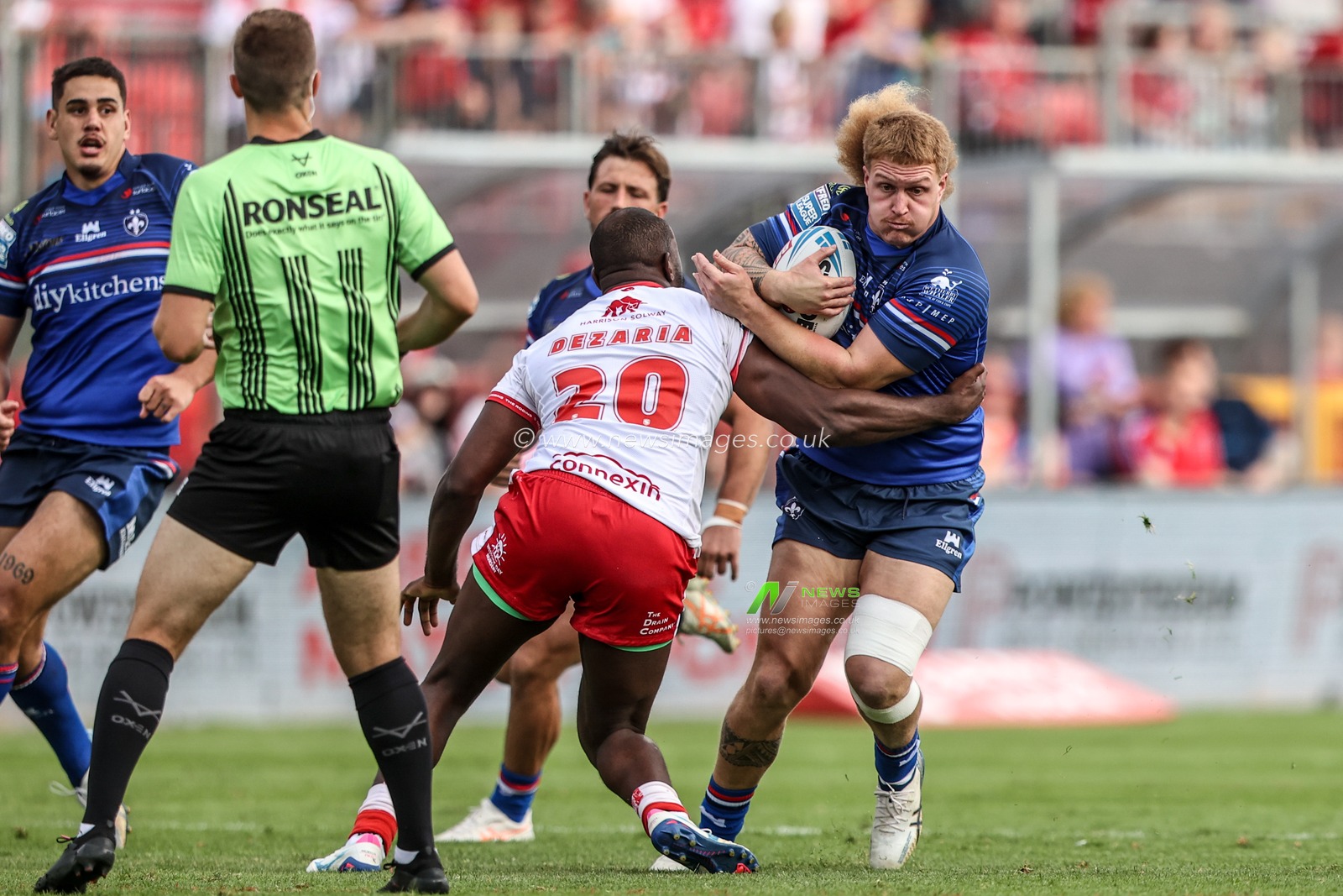 Caius Faatili of Wakefield Trinity is tackled by Jordan Dezaria of Hull KR during the Betfred Super League round 18 match Hull KR vs Wakefield Trinity at Sewell Group Craven Park, Hull, United Kingdom on 11 July 2026

(Photo by Alfie Cosgrove/News Images)