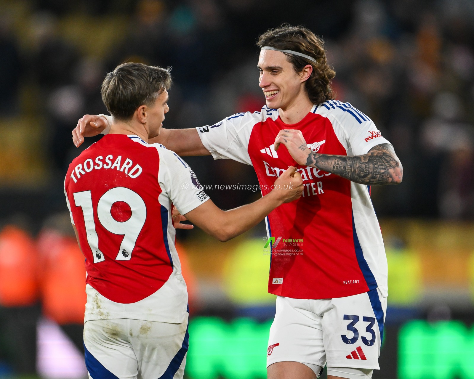Riccardo Calafiori of Arsenal and Leandro Trossard of Arsenal celebrates his sides victory at the end of the Premier League match Wolverhampton Wanderers vs Arsenal at Molineux, Wolverhampton, United Kingdom, 25th January 2025

(Photo by Craig Thomas/News Images)