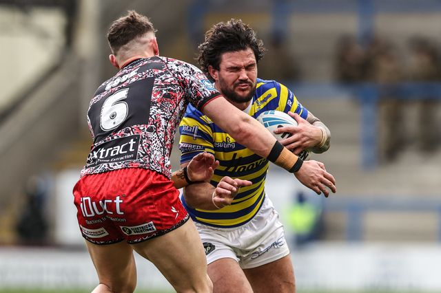 James Bentley of Warrington Wolves is tackled by Adam Cook of Leigh Leopards during the Betfred Super League round 7 match Warrington Wolves vs Leigh Leopards at The Halliwell Jones Stadium, Warrington, United Kingdom on 04 April 2026

(Photo by Alfie Cosgrove/News Images)