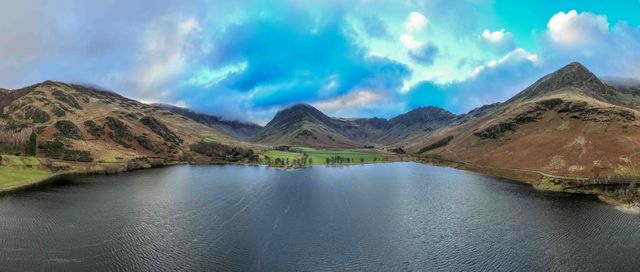 ***EDITORS NOTE THIS IS A PANO PHOTO MADE FROM MULTIPLE SHOTS FROM THE DRONE AND FINISHED IN CAMERA***

An Aerial view of Buttermere and the surrounding mountains during a cold winters morning at Buttermere, TheLake District, Cumbria, United Kingdom, 3rd January 2025

(Photo by Mark Cosgrove/News Images)
