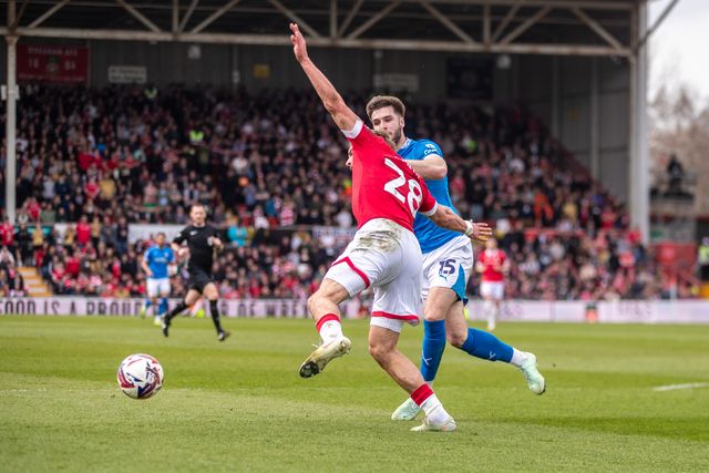 Wrexham's Sam Smith is brought down inside the box during the Sky Bet League 1 match Wrexham vs Stockport County at SToK Cae Ras, Wrexham, United Kingdom, 22nd March 2025

(Photo by Nik Mesney/News Images)