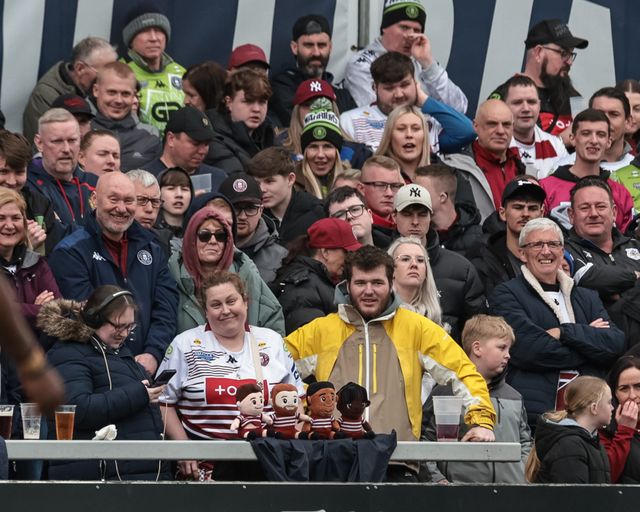 Wigan fans with their Warriors mascots during the Betfred Challenge Cup Quarter Final match Wakefield Trinity vs Wigan Warriors at DIY Kitchens Stadium, Wakefield, United Kingdom on 12 April 2026

(Photo by Mark Cosgrove/News Images)