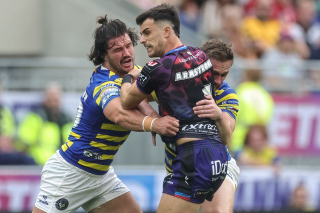 David Armstrong of Leigh Leopards is tackled by James Bentley of Warrington Wolves and Ben Currie of Warrington Wolves during the Betfred Super League Magic Weekend match Leigh Leopards vs Warrington Wolves at Hill Dickinson Stadium, Liverpool, United Kingdom on 04 July 2026

(Photo by Mark Cosgrove/News Images)