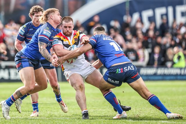 Ebon Scurr of Bradford Bulls is tackled by Caius Faatili of Wakefield Trinity and Caleb Hamlin-Uele of Wakefield Trinity during the Betfred Super League round 8 match Wakefield Trinity vs Bradford Bulls at DIY Kitchens Stadium, Wakefield, United Kingdom on 18 April 2026

(Photo by Alfie Cosgrove/News Images)