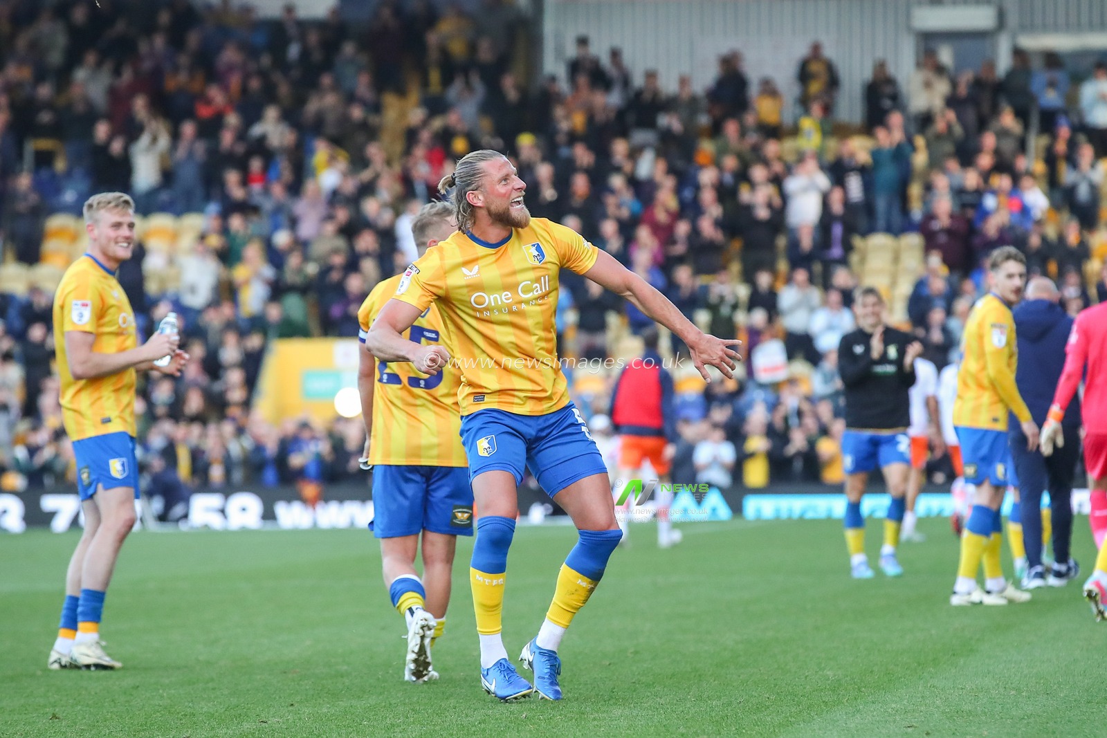 Alfie Kilgour of Mansfield Town celebrates his teams win after the Sky Bet League 1 match Mansfield Town vs Blackpool at One Call Stadium, Mansfield, United Kingdom, 5th October 2024

(Photo by Gareth Evans/News Images)