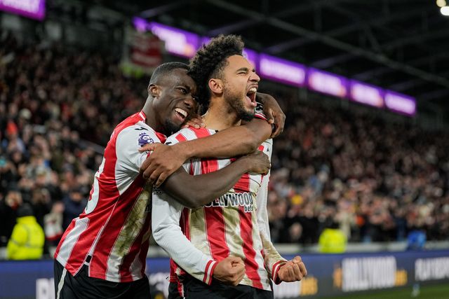 Kevin Schade of Brentford  and Michael Kayode of Brentford celebrate the goal to make it 3-1 during the Premier League match Brentford vs Bournemouth at The Gtech Community Stadium, London, United Kingdom, 27th December 2025

(Photo by Maynard Manyowa/News Images)

*** GER AUT SUI OUT ***