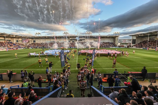 The teams come out for the game during the Betfred Super League round 21 match Warrington Wolves vs Wigan Warriors at Halliwell Jones Stadium, Warrington, United Kingdom, 8th August 2025

(Photo by Alfie Cosgrove/News Images)