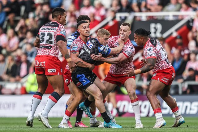 Lachlan Miller of Leeds Rhinos is tackled during the Betfred Super League round 21 match Leigh Leopards vs Leeds Rhinos at Leigh Sports Village, Leigh, United Kingdom, 7th August 2025

(Photo by Alfie Cosgrove/News Images)