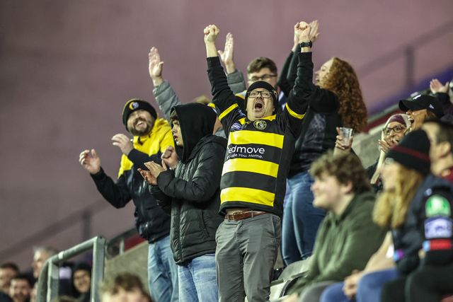 York Knights fans celebrate after scoring a try during the Betfred Super League round 5 match Wigan Warriors vs York Knights at The Brick Community Stadium, Wigan, United Kingdom on 19 March 2026

(Photo by Alfie Cosgrove/News Images)