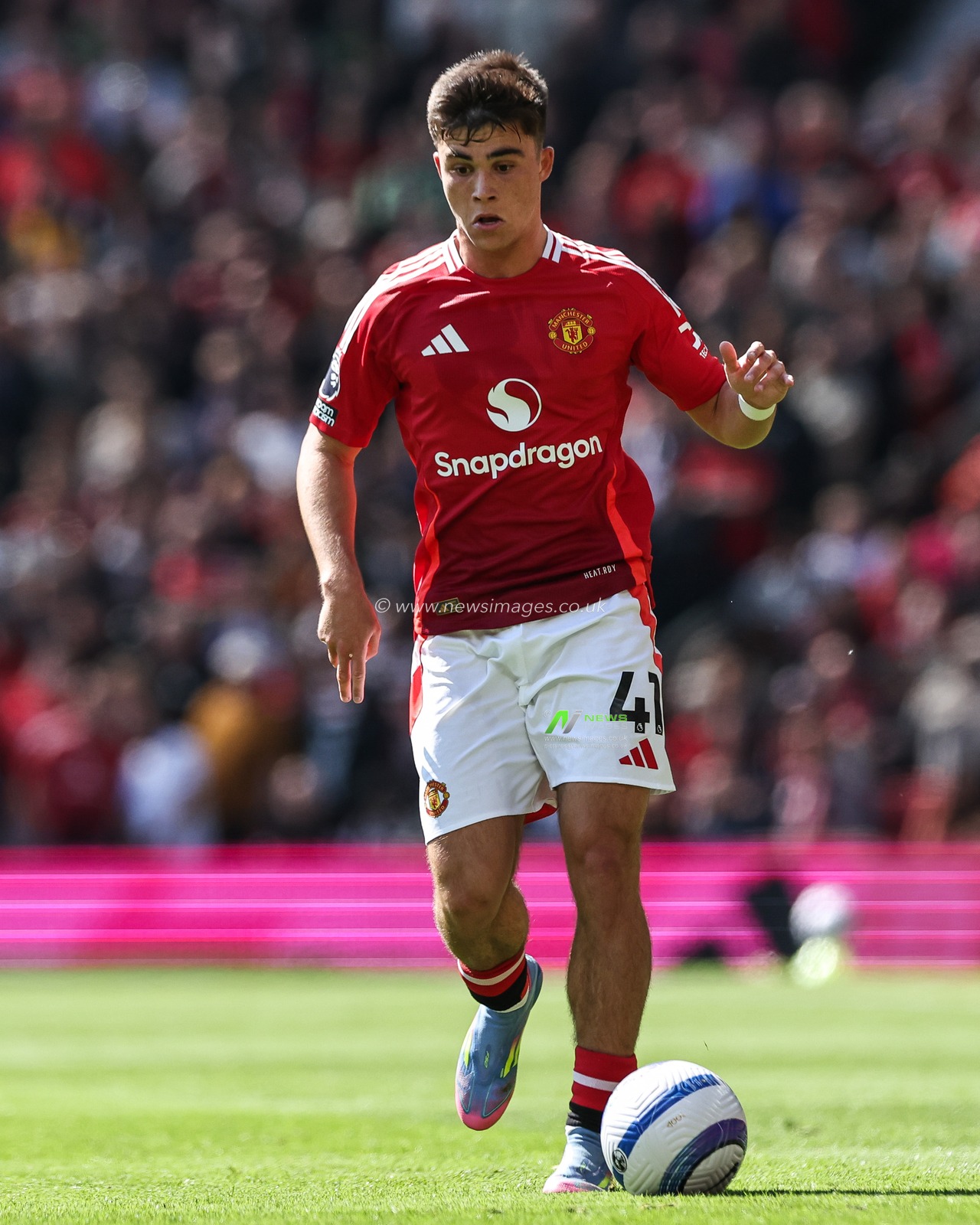Harry Amass of Manchester United goes forward with the ball during the Premier League match Manchester United vs Wolverhampton Wanderers at Old Trafford, Manchester, United Kingdom, 20th April 2025

(Photo by Mark Cosgrove/News Images)