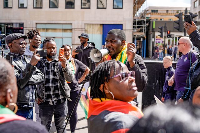 Former political detainees Makomborero Haruzviseh and Shepherd Yuda outside the embassy as UK-based Zimbabweans gather outside the Zimbabwe Embassy in London on 18 April 2026 to protest the Constitution of Zimbabwe Amendment (No. 3) Bill, which critics say would extend President Mnangagwa’s rule until 2030 and strip citizens of the direct vote for president.

(Photo by Maynard Manyowa/News Images)