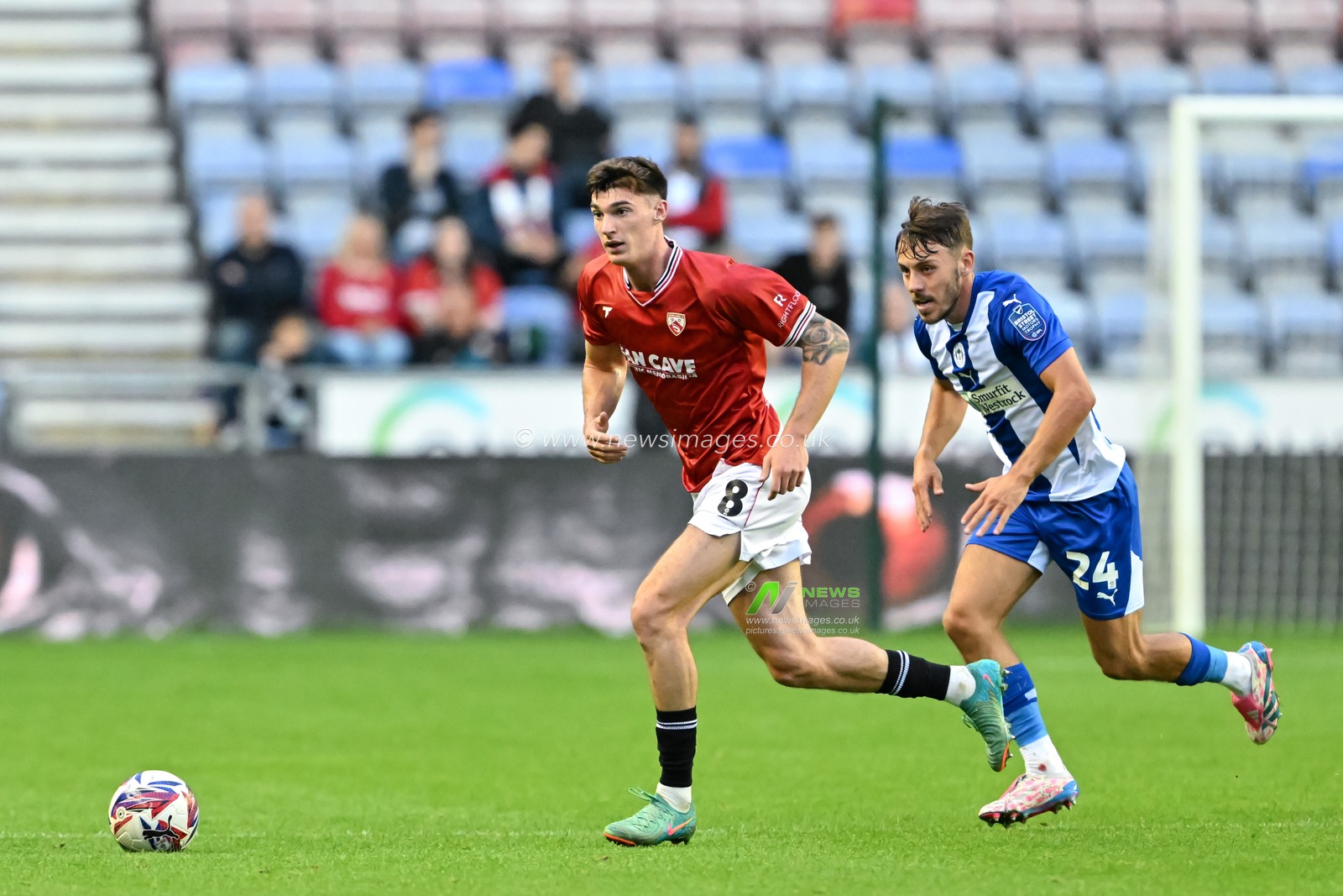 Harvey Macadam of Morecambe in action during the Bristol Street Motors Trophy match Wigan Athletic vs Morecambe at DW Stadium, Wigan, United Kingdom, 3rd September 2024

(Photo by Cody Froggatt/News Images)