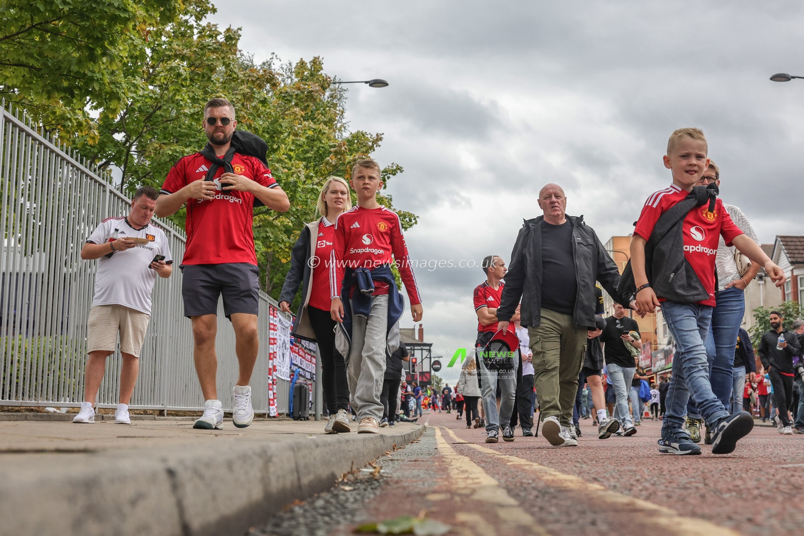 Manchester United fans make their way to the game during the Premier League match Manchester United vs Burnley at Old Trafford, Manchester, United Kingdom, 30th August 2025

(Photo by Mark Cosgrove/News Images)