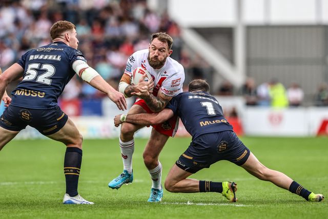 Daryl Clark of St. Helens is tackled during the Betfred Super League round 16 match St Helens vs Salford Red Devils at Totally Wicked Stadium, St Helens, United Kingdom, 29th June 2025

(Photo by Alfie Cosgrove/News Images)