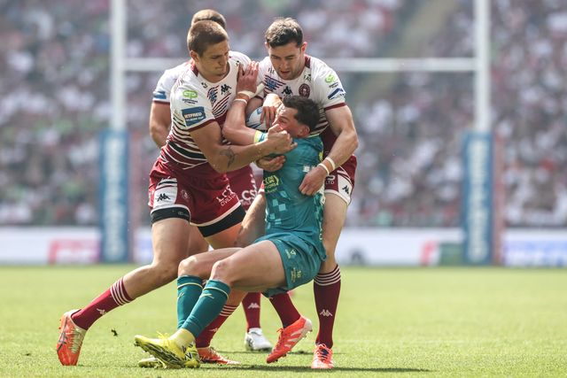 Jack Broadbent of Hull KR is tackled by Sam Walters of Wigan Warriors and Jake Wardle of Wigan Warriors during the Betfred Challenge Cup Final match Wigan Warriors vs Hull KR at Wembley Stadium, London, United Kingdom on 30 May 2026

(Photo by Alfie Cosgrove/News Images)