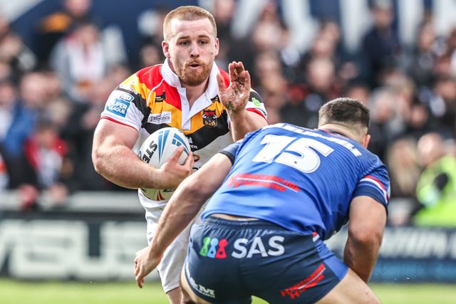 Ebon Scurr of Bradford Bulls is tackled by Caleb Hamlin-Uele of Wakefield Trinity during the Betfred Super League round 8 match Wakefield Trinity vs Bradford Bulls at DIY Kitchens Stadium, Wakefield, United Kingdom on 18 April 2026

(Photo by Alfie Cosgrove/News Images)