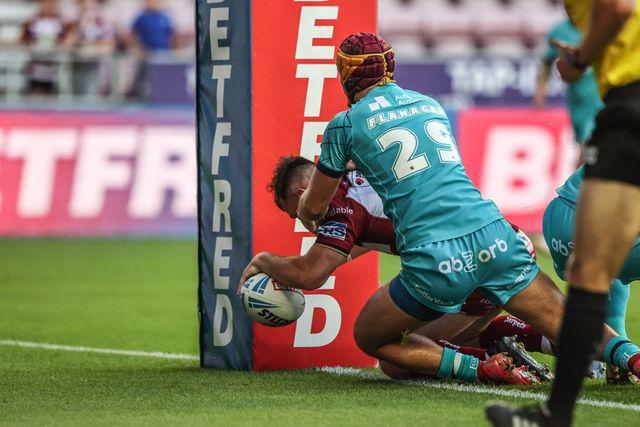 Harry Smith of Wigan Warriors goes over for a try however it is disallowed after review during the Betfred Super League round 18 match Wigan Warriors vs Huddersfield Giants at The Brick Community Stadium, Wigan, United Kingdom, 11th July 2025

(Photo by Alfie Cosgrove/News Images)