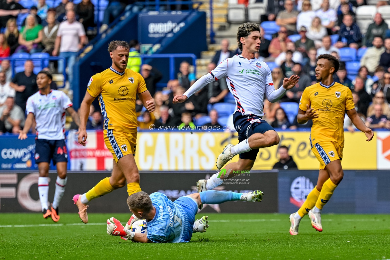 Nathan Bishop of AFC Wimbledon  makes a brave save during the Sky Bet League 1 match Bolton Wanderers vs AFC Wimbledon at Toughsheet Community Stadium, Bolton, United Kingdom, 6th September 2025

(Photo by Adam Gee/News Images)