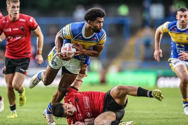 Kallum Watkins of Leeds Rhinos is tackled during the Betfred Super League round 19 match Leeds Rhinos vs Salford Red Devils at Headingley Stadium, Leeds, United Kingdom, 18th July 2025

(Photo by Alfie Cosgrove/News Images)