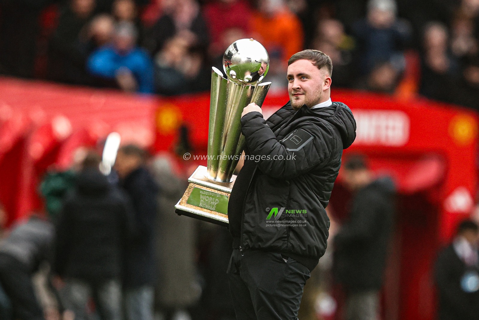 Luke ‘The Nuke’ Littler shows his PDC World Championship trophy after winning it for his second consecutive year during the Premier League match Manchester United vs Tottenham Hotspur at Old Trafford, Manchester, United Kingdom on 07 February 2026

(Photo by Alfie Cosgrove/News Images)
