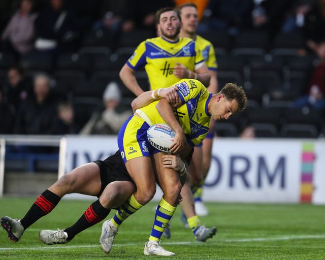 Cai Taylor-Wray of Warrington Wolves is tackled during the Betfred Challenge Cup match Widnes Vikings vs Warrington Wolves at DCBL Stadium, Widnes, United Kingdom, 15th March 2025

(Photo by Gareth Evans/News Images)