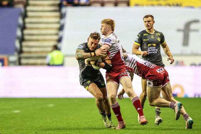 Chris Hankinson of Leeds Rhinos is tackled by Adam Keighran of Wigan Warriors during the Betfred Super League round 11 match Wigan Warriors vs Leeds Rhinos at The Brick Community Stadium, Wigan, United Kingdom on 15 May 2026

(Photo by Alfie Cosgrove/News Images)