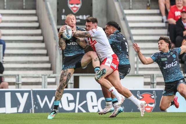 Josh Charley of Leigh Leopards jumps up to win the high ball during the Betfred Super League round 19 match St Helens vs Leigh Leopards at Totally Wicked Stadium, St Helens, United Kingdom, 17th July 2025

(Photo by Alfie Cosgrove/News Images)