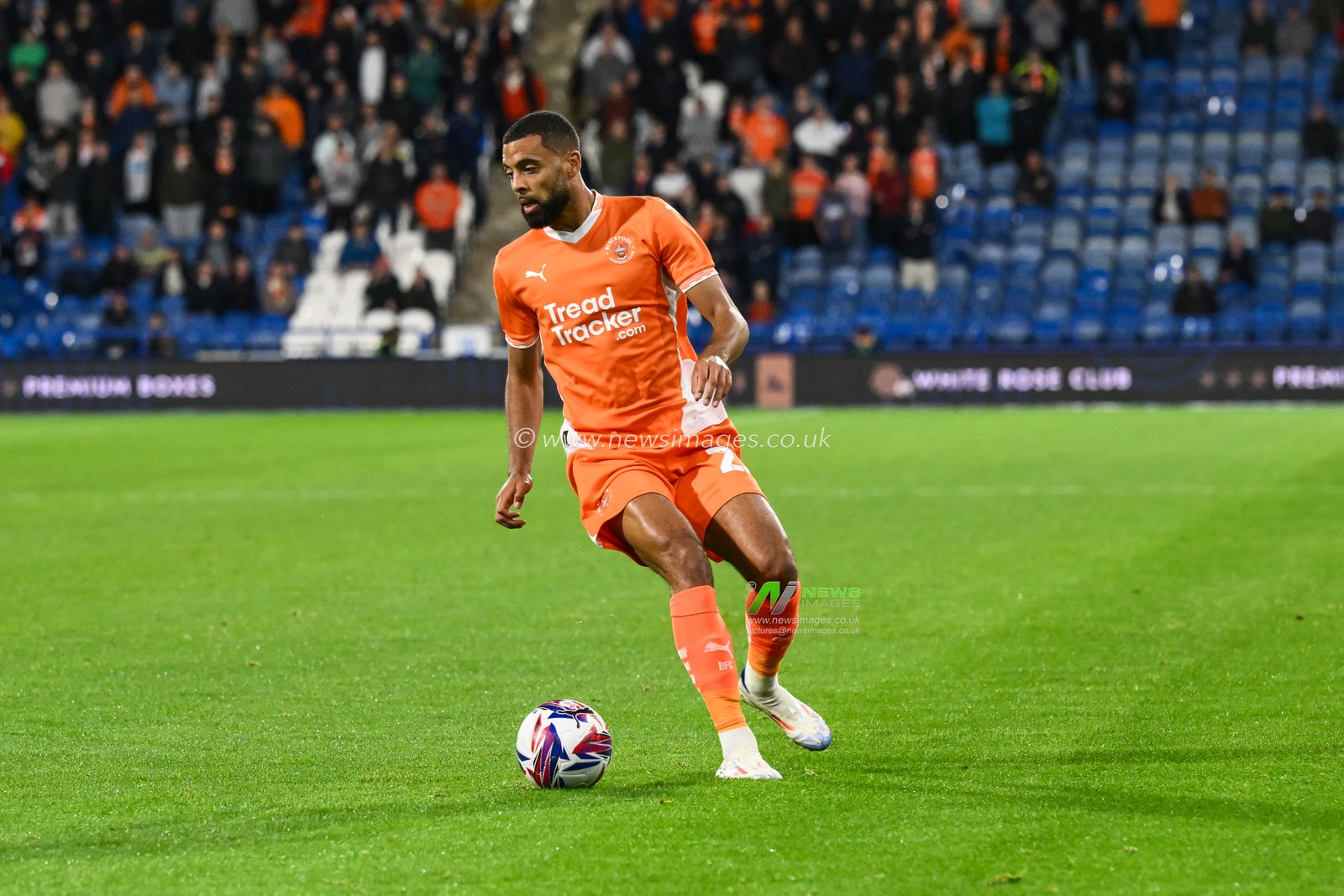 CJ Hamilton of Blackpool makes a break with the ball  during the Sky Bet League 1 match Huddersfield Town vs Blackpool at John Smith's Stadium, Huddersfield, United Kingdom, 24th September 2024

(Photo by Craig Thomas/News Images)