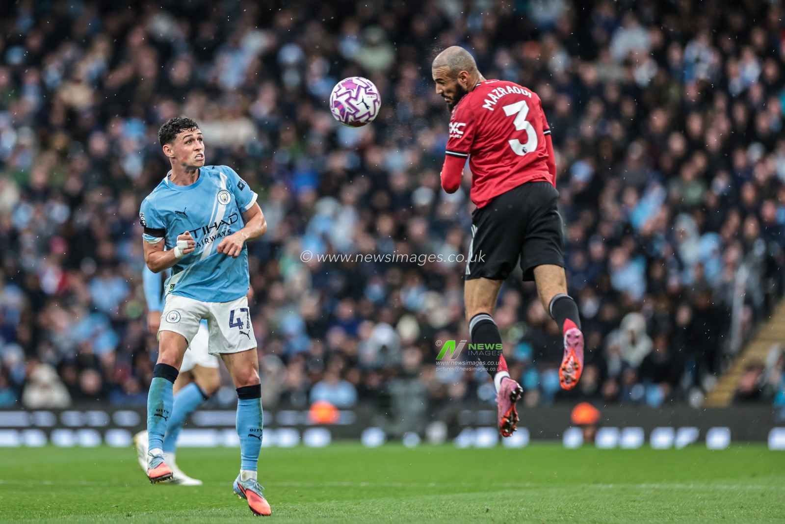 Noussair Mazraoui of Manchester United jumps up to win the high ball during the Premier League match Manchester City vs Manchester United at Etihad Stadium, Manchester, United Kingdom, 14th September 2025

(Photo by Mark Cosgrove/News Images)