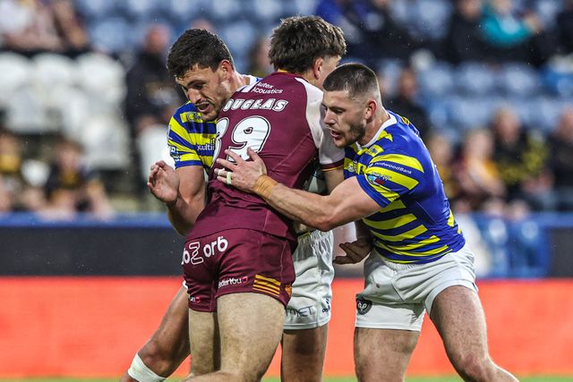Jacob Douglas of Huddersfield Giants is tackled by Sam Stone of Warrington Wolves and Danny Walker of Warrington Wolves during the Betfred Super League round 10 match Huddersfield Giants vs Warrington Wolves at Accu Stadium, Huddersfield, United Kingdom on 02 May 2026

(Photo by Alfie Cosgrove/News Images)