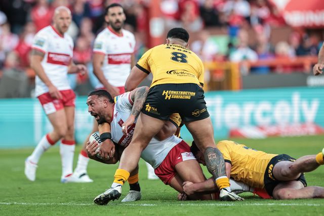 Elliot Minchella of Hull KR is tackled by Renouf Atoni of Castleford Tigers during the Betfred Super League round 10 match Hull KR vs Castleford Tigers at Sewell Group Craven Park, Hull, United Kingdom on 30 April 2026

(Photo by Mark Cosgrove/News Images)