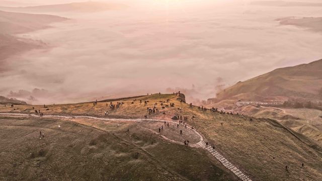 Sunrise hikers walk to the summit of Mam Tor as they watch the sunrise and admire the cloud inversion in the Hope Valley at Mam Tor in the Peak District at Mam Tor, Castleton, United Kingdom on 21 March 2026

(Photo by Mark Cosgrove/News Images)