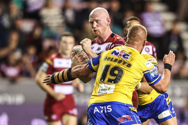 Liam Farrell of Wigan Warriors is tackled by Tom Holroyd of Leeds Rhinos during the Betfred Super League round 27 match Wigan Warriors vs Leeds Rhinos at The Brick Community Stadium, Wigan, United Kingdom, 19th September 2025

(Photo by Alfie Cosgrove/News Images)