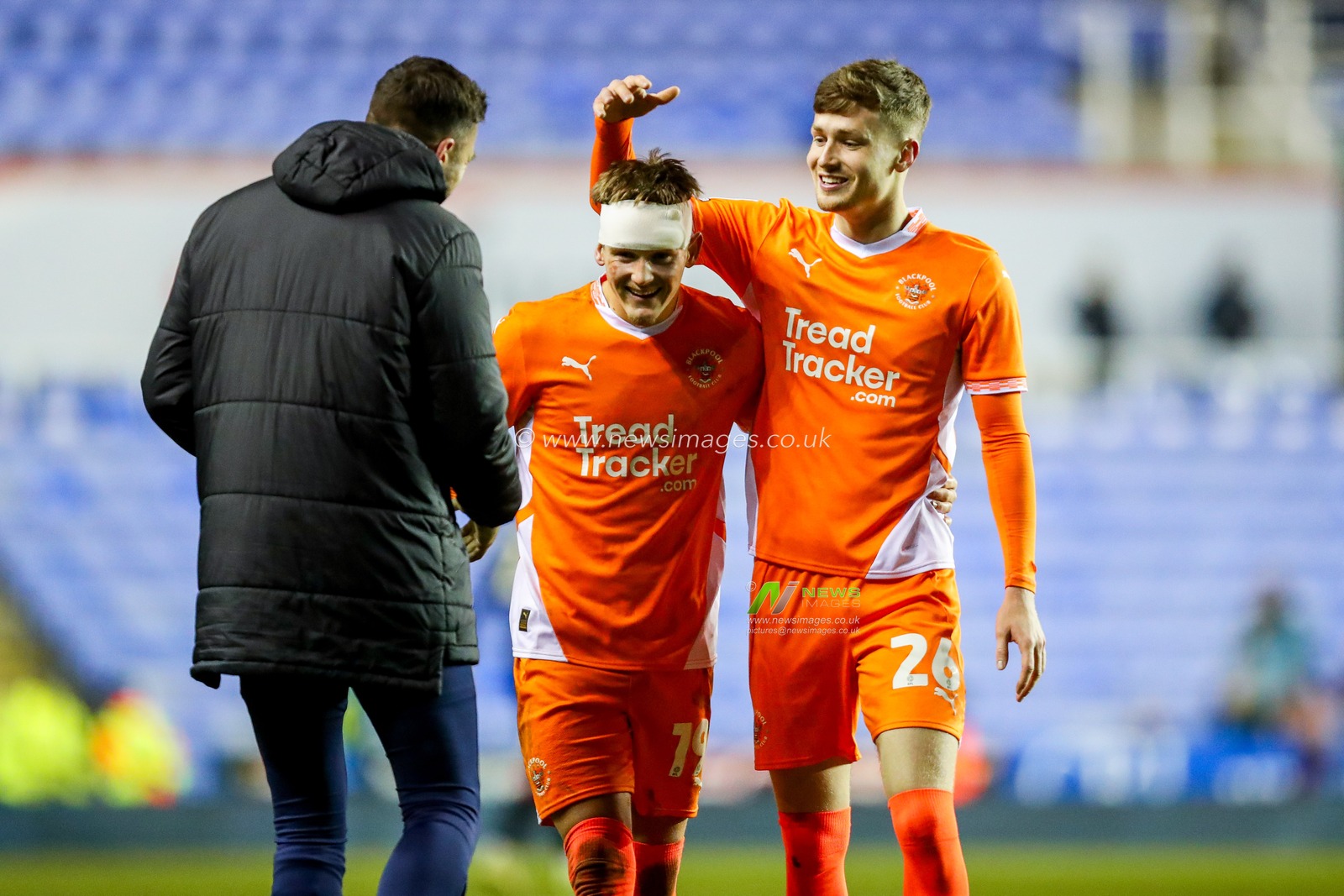 Richard O'Donnell, Dom Ballard and Zac Ashworth of Blackpool celebrate after the teams victory following the Sky Bet League 1 match Reading vs Blackpool at Select Car Leasing Stadium, Reading, United Kingdom, 14th December 2024

(Photo by Izzy Poles/News Images)