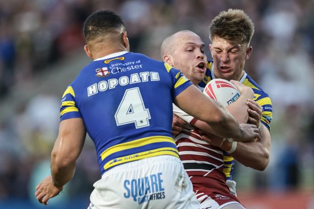Liam Marshall of Wigan Warriors is tackled by Ewan Irwin of Warrington Wolves during the Betfred Super League round 9 match Warrington Wolves vs Wigan Warriors at The Halliwell Jones Stadium, Warrington, United Kingdom on 24 April 2026

(Photo by Mark Cosgrove/News Images)