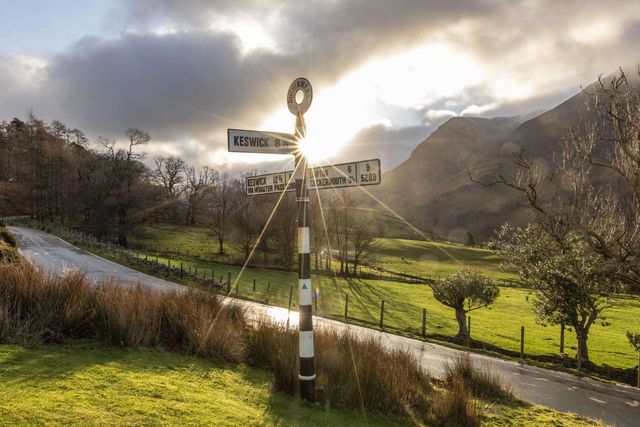 The sun shines through a road sign at Buttermere during a cold winters morning at Buttermere, TheLake District, Cumbria, United Kingdom, 3rd January 2025

(Photo by Mark Cosgrove/News Images)