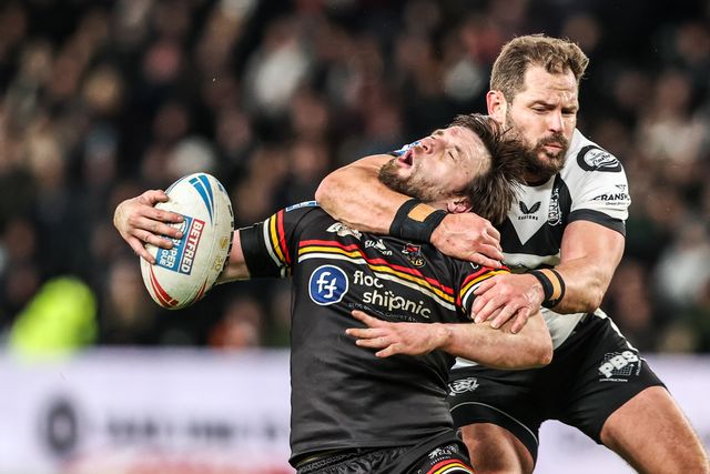 Joe Mellor of Bradford Bulls is tackled by the neck by Aidan Sezer of Hull FC during the Betfred Super League round 1 match Hull FC vs Bradford Bulls at MKM Stadium, Hull, United Kingdom on 14 February 2026

(Photo by Alfie Cosgrove/News Images)
