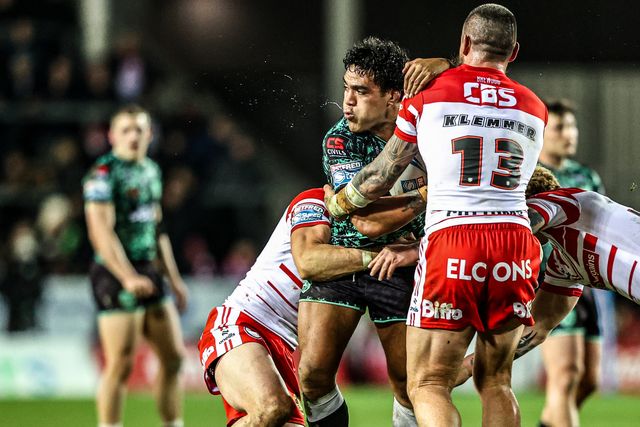 Joe Ofahengaue of Leigh Leopards is tackled by Shane Wright of St Helens and David Klemmer of St Helens during the Betfred Super League match St Helens vs Leigh Leopards at The BrewDog Stadium, St Helens, United Kingdom on 20 February 2026

(Photo by Alfie Cosgrove/News Images)
