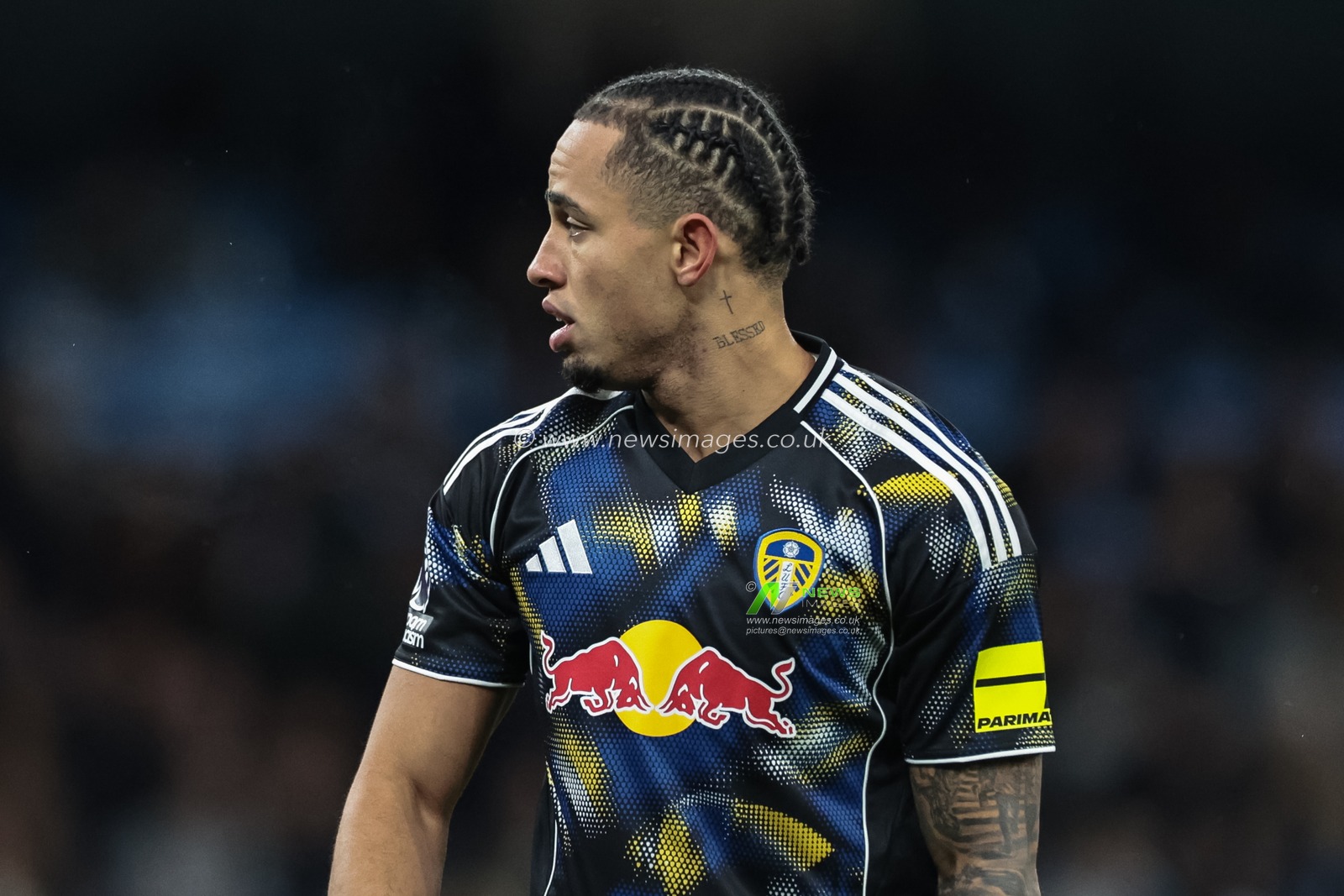 Noah Okafor of Leeds United platted hair and blessed cross tattoo during the Premier League match Manchester City vs Leeds United at Etihad Stadium, Manchester, United Kingdom, 29th November 2025

(Photo by Mark Cosgrove/News Images)

*** GER AUT SUI OUT ***