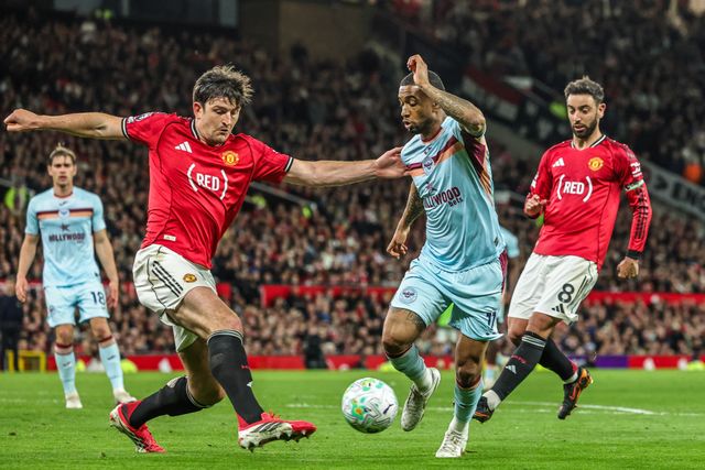 Reiss Nelson of Brentford and Harry Maguire of Manchester United battle for the ball during the Premier League match Manchester United vs Brentford at Old Trafford, Manchester, United Kingdom on 27 April 2026

(Photo by Mark Cosgrove/News Images)