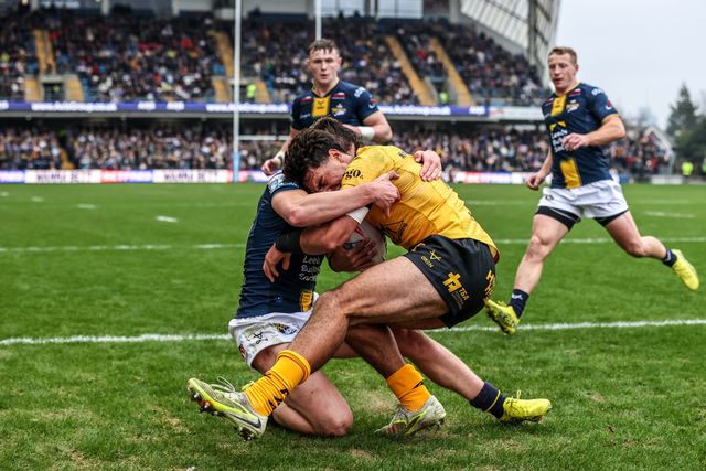 Krystian Mapapalangi of Castleford Tigers is tackled by George Brown of Leeds Rhinos during the Betfred Super League round 4 match Leeds Rhinos vs Castleford Tigers at AMT Headingley Stadium, Leeds, United Kingdom on 08 March 2026

(Photo by Alfie Cosgrove/News Images)
