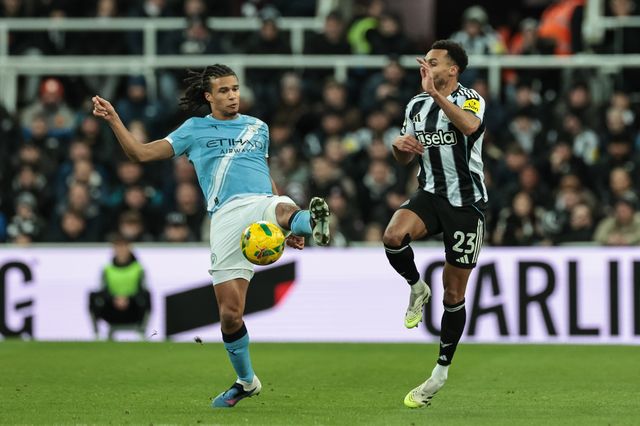 Nathan Ake of Manchester City controls the ball as Jacob Murphy of Newcastle Untied pressures during the Carabao Cup Semi-finals First Leg Newcastle United vs Manchester City at St. James's Park, Newcastle, United Kingdom, 13th January 2026

(Photo by Mark Cosgrove/News Images)