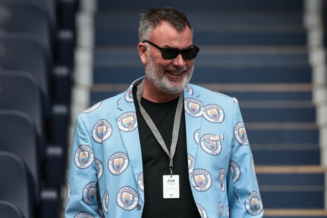 A Manchester City fan with a City suit on during the Premier League match Manchester City vs Arsenal at Etihad Stadium, Manchester, United Kingdom on 19 April 2026

(Photo by Mark Cosgrove/News Images)