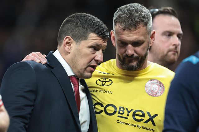 Matt Peet Head Coach of Wigan Warriors speaks to Sean O'Loughlin at half time as they head to the dressing room during the 2025 Betfred Super League Grand Final Hull KR v Wigan Warriors at Old Trafford, Manchester, United Kingdom, 11th October 2025

(Photo by Mark Cosgrove/News Images)