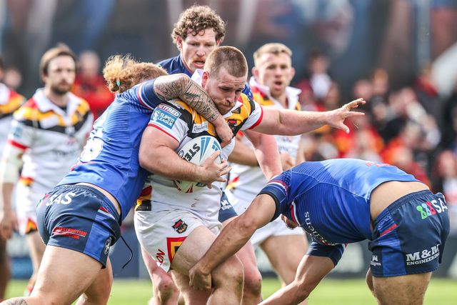 Ebon Scurr of Bradford Bulls is tackled by Caius Faatili of Wakefield Trinity and Caleb Hamlin-Uele of Wakefield Trinity during the Betfred Super League round 8 match Wakefield Trinity vs Bradford Bulls at DIY Kitchens Stadium, Wakefield, United Kingdom on 18 April 2026

(Photo by Alfie Cosgrove/News Images)