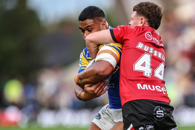 Sam Lisone of Leeds Rhinos is tackled during the Betfred Super League round 19 match Leeds Rhinos vs Salford Red Devils at Headingley Stadium, Leeds, United Kingdom, 18th July 2025

(Photo by Alfie Cosgrove/News Images)