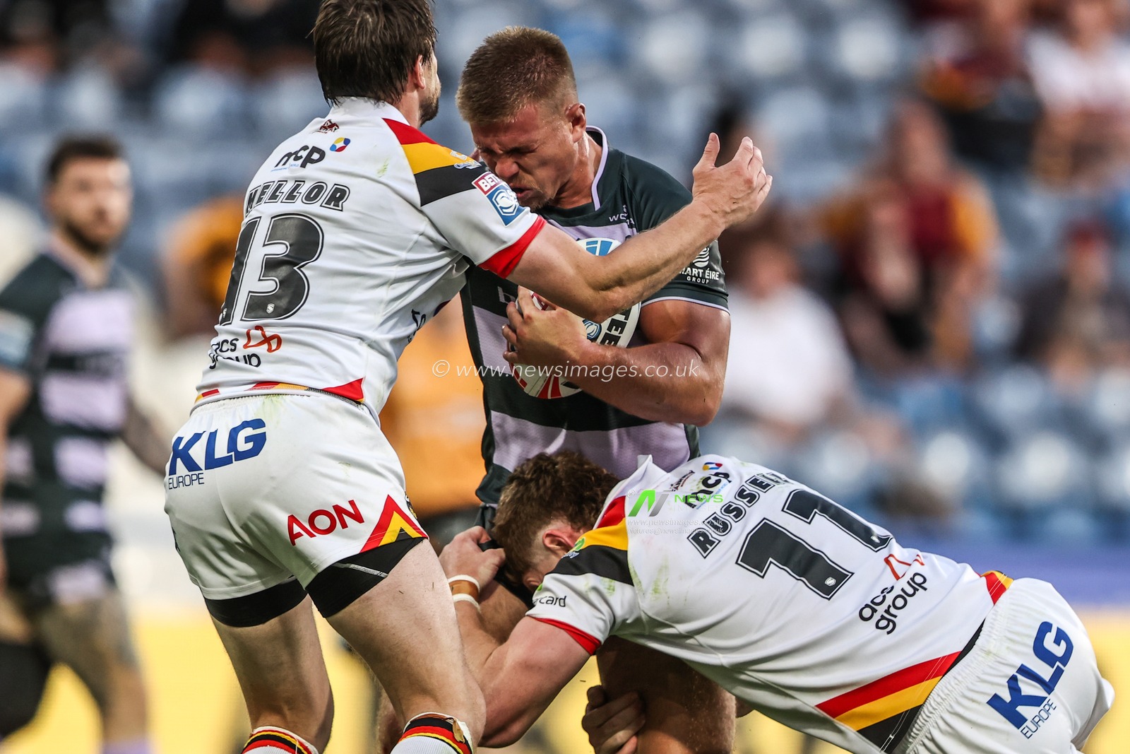 Harry Rushton of Huddersfield Giants is tackled by Joe Mellor of Bradford Bulls and Dan Russell of Bradford Bulls during the Betfred Super League round 18 match Huddersfield Giants vs Bradford Bulls at Accu Stadium, Huddersfield, United Kingdom on 10 July 2026

(Photo by Alfie Cosgrove/News Images)